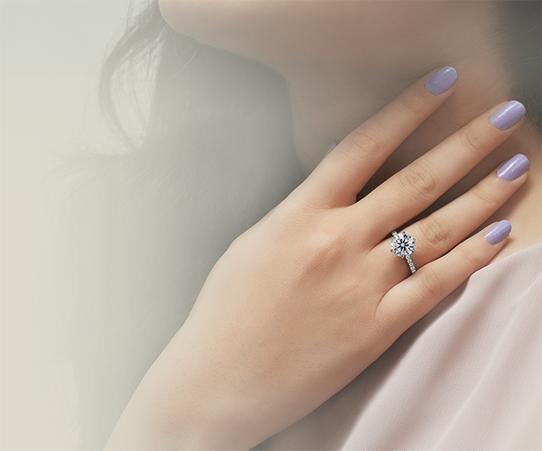 girl is showing her lab diamond engagement ring made by crown jewels