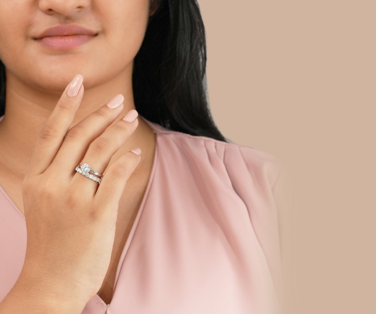 A girl is presenting her diamond wedding ring made with lab grown diamond at crown jewels